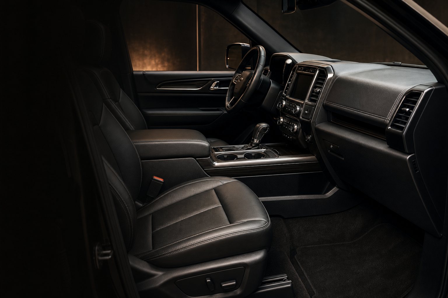 Clean black vehicle interior after detailing