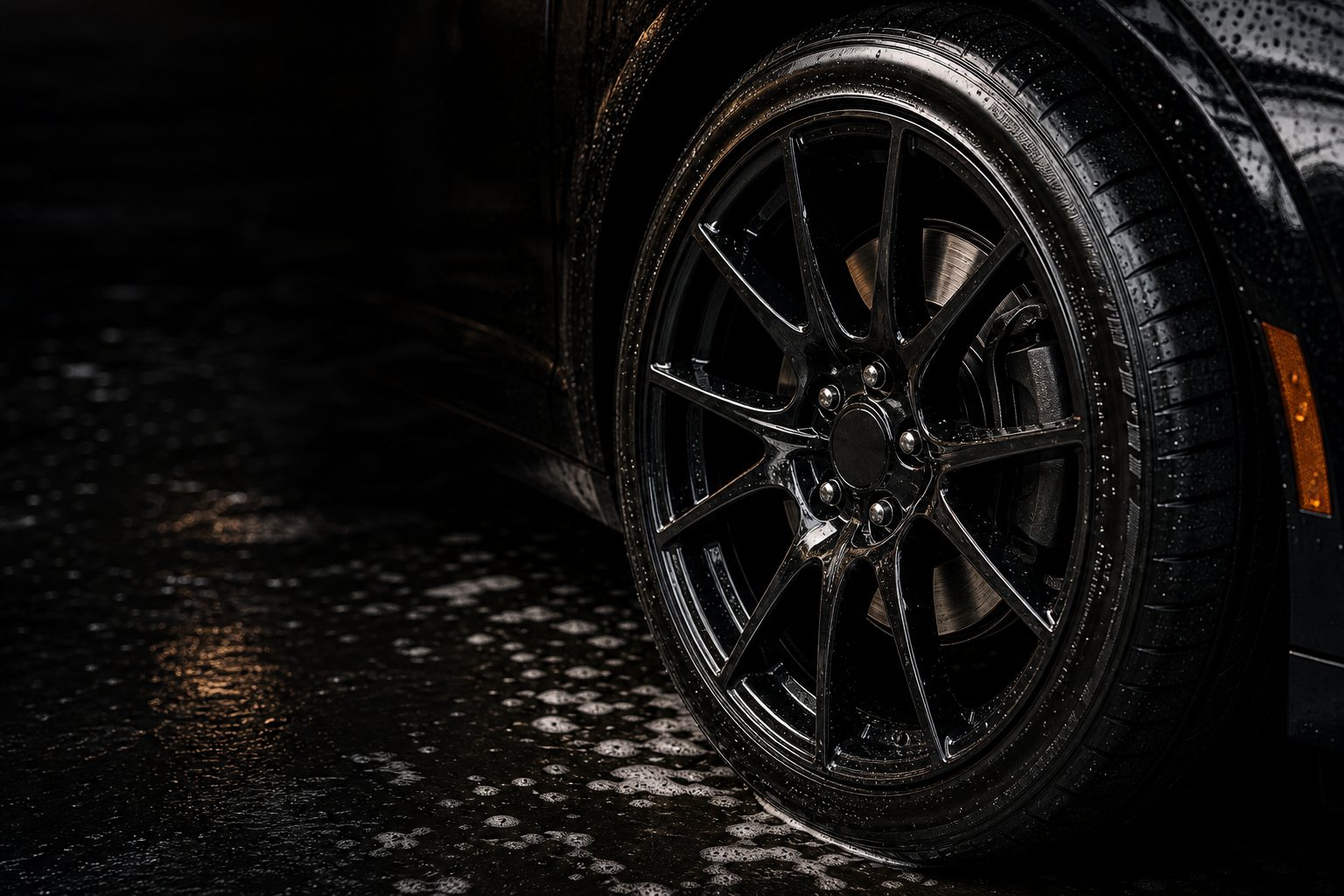 Detailed black wheel and tire with fresh dressing